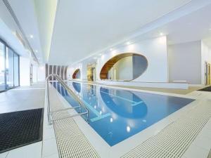 a large swimming pool with blue water in a building at MA-a 1118 in Melbourne