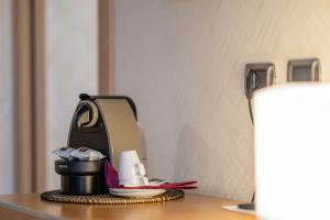 Příslušenství pro přípravu čaje a kávy v ubytování Best Western Hotel Armando