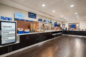 a store with a counter with aasteryasteryasteryasteryasteryasteryasteryasteryastery at Holiday Inn Express Hotel & Suites McDonough, an IHG Hotel in McDonough