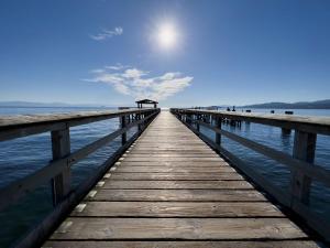 a pier stretches out into the water at The Oceanside, a Coast Hotel in Sechelt