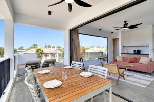 a dining room and living room with a table and chairs at Villa Valena Apartment 7 with Cooling Pool in Kralendijk