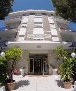 a building with a sign on the front of it at Hotel Ausonia in Rimini