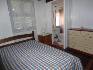 Cama ou camas em um quarto em Hospedagem Clair
