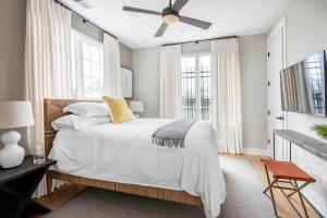 a bedroom with a bed and a ceiling fan at Sky's the Limit in Atlanta