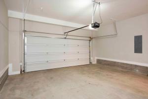 an empty garage with white walls and white garage doors at Bird's Eye View in Atlanta +31 photos