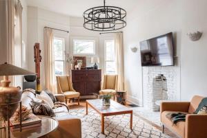 a living room with a couch and a fireplace at Wabi-Sabi in Atlanta