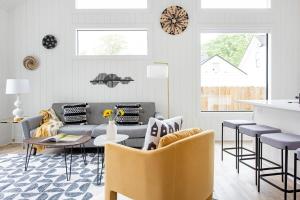 a living room with a couch and a table and chairs at Dapper Dan in Atlanta +21 photos