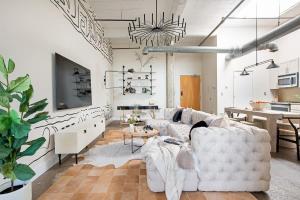 a living room with a white couch and a table at Beltline Shrine in Atlanta +43 photos