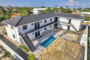 an aerial view of a white house with a swimming pool at Villa Valena Apartment 5 with Cooling Pool in Kralendijk
