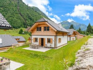 a house in the mountains with a yard at Haus Rapunzel in Donnersbachwald