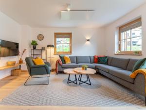 a living room with a couch and a table at Haus Rapunzel in Donnersbachwald