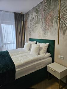 Posteľ alebo postele v izbe v ubytovaní Apartament Deluxe Centrum Warszawa