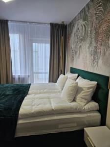 Posteľ alebo postele v izbe v ubytovaní Apartament Deluxe Centrum Warszawa
