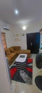a living room with a couch and a table at Nasaplace Venture in Badore