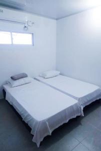 Llit o llits en una habitació de Refugio, Casa de la Playa