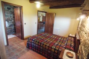 A bed or beds in a room at Apartamentos rurales Casa Do Cabo