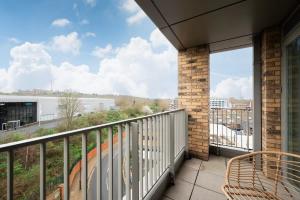 a balcony with a view of a city at Chic 2BR Flat in Greater London in London