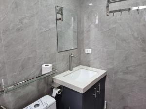 a bathroom with a sink and a toilet and a mirror at Mary Ann Gurel, Amaya 2 Tanza Cavite Staycation, Transient, Short Term,Long Term, Condo Type with own Balcony. in Tanza