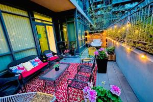 a balcony with chairs and a couch on a building at Luxury Suite With Private Terrace Downtown Toronto in Toronto