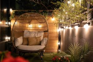 a white chair in a bird cage with lights at Luxury Suite With Private Terrace Downtown Toronto in Toronto