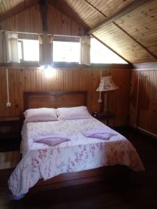 Posteľ alebo postele v izbe v ubytovaní Chalé Maringá