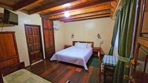 Postel nebo postele na pokoji v ubytování Hostería Finca El Pigual