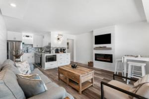 a living room with a couch and a table at The Summit 808 - Luxury Beach Resort Condo - Beachfront - Incredible Views - BEACH CHAIRS AND SUNSHADE Provided In Condo in Panama City Beach