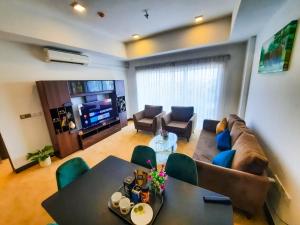 a living room with a couch and a table at Sea Wave Luxuy Apartment in Negombo