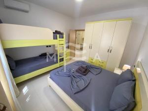 a small room with two bunk beds and a mirror at Villa Exceptional 832 in Golem