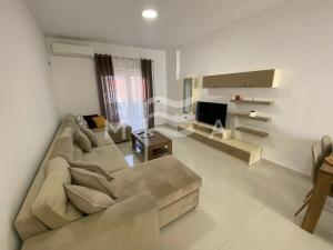 a living room with a couch and a television at Villa Exceptional 832 in Golem