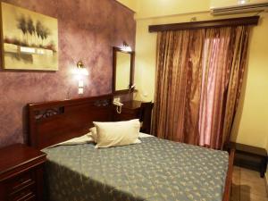 Postel nebo postele na pokoji v ubytování Pergamos Hotel