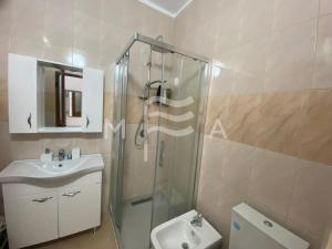 a bathroom with a shower and a sink and a toilet at SEAVIEW apartment 616 in Durrës