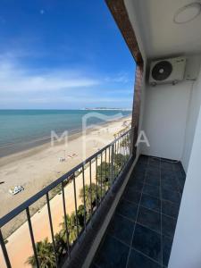a balcony with a view of the beach at Essential 516 in Durrës