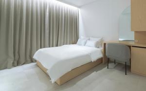 Postel nebo postele na pokoji v ubytování Aank Hotel Wolgot + 29 fotografií