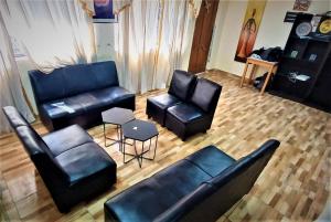 an overhead view of a living room with leather furniture at Carlos Guest House 1 Cusco in Cusco