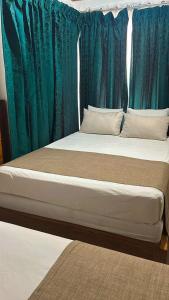 Postelja oz. postelje v sobi nastanitve Hotel Javy