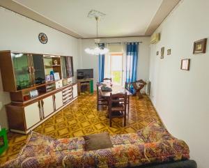 a living room with a couch and a table at Ture's Home in Milazzo