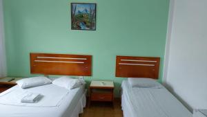 Uma cama ou camas num quarto em PLAZA HOTEL MARABÁ
