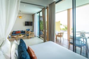 a bedroom with a bed and a living room at Bandara Pool Villas, Phuket in Panwa Beach +115 photos