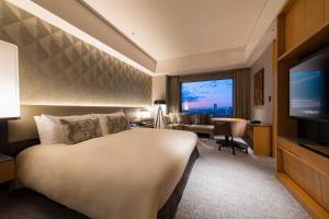 a hotel room with a bed and a television at Cerulean Tower Tokyu Hotel, A Pan Pacific Partner Hotel in Tokyo
