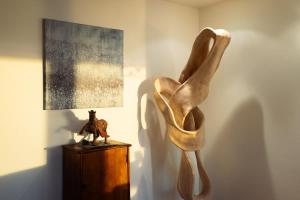 a sculpture of a woman on a table next to a lamp at Sunset Serenity On The Cliffs! in San Diego