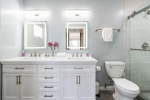 a bathroom with a sink and a toilet and a shower at Sunset Serenity On The Cliffs! in San Diego