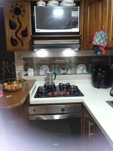 Een keuken of kitchenette bij Hermoso apartamento en Girardota
