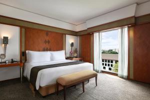 Ein Bett oder Betten in einem Zimmer der Unterkunft The Sukhothai Bangkok
