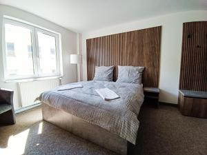 Postel nebo postele na pokoji v ubytování Apartmány Plzeň Zborovská 22 a