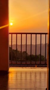 a view of the sunset from a balcony at The SKYi County Dapoli in Dapoli