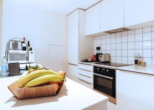 a bunch of bananas on a counter in a kitchen at R213 Residences Botanique in Brussels +217 photos