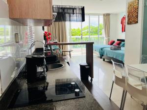 a kitchen with a sink and a living room at Town Center Paradise in Playa Blanca in Playa Blanca