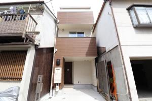 a view of a house from the street at King's House in Osaka