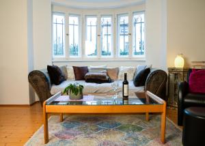 a living room with a couch and a table at Ferienwohnung Weintraube in Dresden